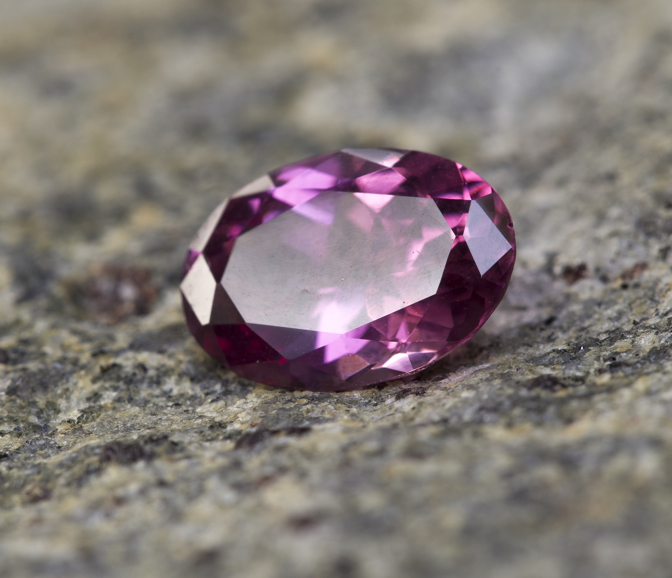 showing a purplish pink spinel