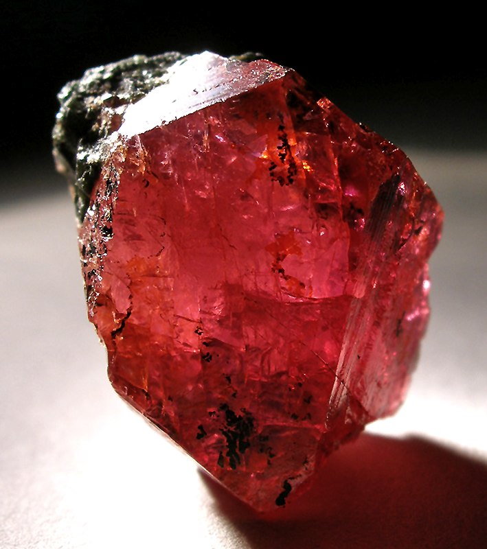 cover image of the article, showing a rough ruby gemstone